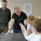 Inspecting a full-arm cast on a patient are (from left) Dunedin Urgent Doctors and Accident...