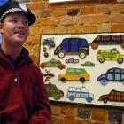 Intellectually disabled Dunedin artist James Withnall with the collage he and his artist helper...