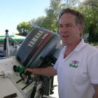 Invercargill holidaymaker Greg Mulvey fills his boat's fuel tank with cheaper petrol at Wanaka BP...