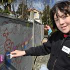 Ioane Matheson (12), of Dunedin, and cousin Jasmine Matheson (11), of Invercargill, paint a mural...