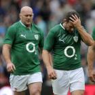 Ireland's Fergus McFadden (R) walks off the pitch following the friendly rugby international test...