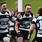 Israel Dagg (C) celebrates with Hawke's Bay teamates Ihaia West (R) and Brendon O'Connor after...