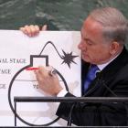 Israel Prime Minister Benjamin Netanyahu draws a red line on a graphic of a bomb as he addresses...