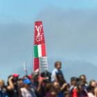 Italy's Luna Rossa AC72 catamaran passes behind spectators at a Louis Vuitton Cup semi-final...