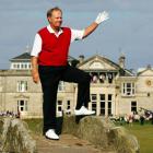 Jack Nicklaus waves to the crowd from Swilcan Bridge on the 18th fairway at St Andrews. Photo...