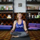 Jae Omnet relaxes in her new yoga studio in Oamaru. Photo by Rebecca Ryan.
