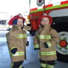 Jake McGinnis (left) and Harry Ryan (both aged 2), of Alexandra, kitted out in firemen's gear,...