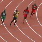 Jamaica's Usain Bolt on his way to winning his men's 200m round 1 heat. REUTERS/Stefan Wermuth