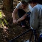 Jane Adcroft and Carla Braun Elwert with a tuatara. Photo supplied.