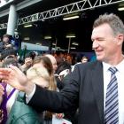 Japan coach, All Black great John Kirwan, greets well-wishers as his team arrives at Auckland...