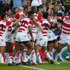 japan_players_celebrate_after_a_scoring_a_try_to_b_55fda0e433.jpg