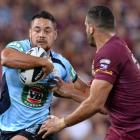 Jarryd Hayne of New South Wales tries to break through the Queensland defence. (Photo by Bradley...