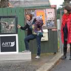 Jasmine Lamorie, Azalea Nielsen (7 months) and Maya Tate-Manning check out the Art Tardis in...