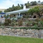 Jeff Matheson built the stone walls between the house and the tennis court. Photos by Gillian Vine.
