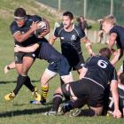 Jeke Maiono (Pirates) runs mid air up the edge of the ruck. Photo by Paul Langley