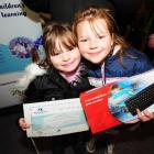 Calton Hill School pupils Jessica (7) and Renee (8) Carson show their mother Lorraine's...
