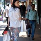 Jess Gleeson, of Dunedin fashion outlet Carlson, makes the most of George St yesterday, before a...