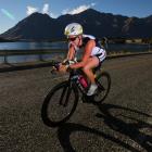 Jess Simson on her way to second place in the Challenge Wanaka half-ironman.  Photo by marathon...