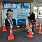 Jesse Brazil, of Thermawood Otago, cordons off an area  in  front of Michael Woodhouse's...