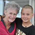 Jessica Power (9), of Ocean View, models her freshly shaved head with her grandmother, Carol...