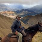 Jim Hore rests his horse near the top of Mt Alpha after a challenging climb from Glendhu Bay on...