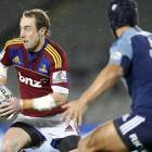 Jimmy Cowan (Highlanders) looks to get round Benson Stanley (Blues) in their Super 15 match at...