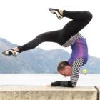 Jodie Glinster demonstrates her acrobatic skills on the shores of Lake Wakatipu in Queenstown...