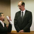Joe Karam speaks with David Bain as he stands in the dock at High Court, Christchurch, at his...
