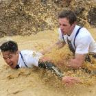 Joe Laiman (30) and Steven Marshall (27) battle their way through one of the obstacles.