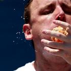 Joey Chestnut competes in the 2012 Nathan's Famous Fourth of July International Eating Contest at...