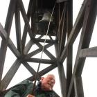 John Burton rings the bell at St Paul's Cathedral yesterday morning, heralding the arrival of the...