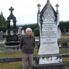 John Foley beside the grave of union organiser William Hobson Lundon, who died in 1907 and is...