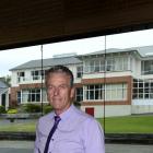 John McGlashan College principal Mike Corkery admires the inside of the school's new gymnasium,...