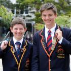 John McGlashan College pupils Andrew Logie (left) and Ed Davies smile after receiving  McGlashan...