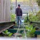 John Murray rides on the incline lift he built to keep a 30-year-old promise to wife Sandra. ...