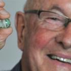 John Verboeket with his prized marble, which he recently retrieved having buried it under a house...
