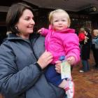 Joining a queue outside the Regent Theatre in Dunedin yesterday are Alison Breese and daughter...
