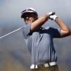 Joint leader Matthew Griffin, of Australia, hits a fairway iron during round two of the New...