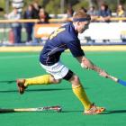 Joseph Gunson (Auckland Grammar) controls the ball ahead of Kings College defenders Cameron...