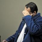 Joseph Lepper hides from the camera in the High Court at Dunedin while pleading guilty to a sex...