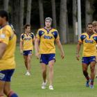 Josh Bekhuis (centre) takes part in Highlanders training in Logan Park this week along with (from...