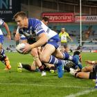 Josh Morris goes over to score for the Bulldogs. Photo Getty Images