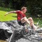 Josh Rosie (15) makes a splash, watched by William Helm (7).
