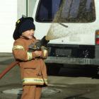 Josiah Stephenson (6), of Milton, demonstrates how he would be a good fireman at the Milton fire...
