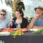 Judges Greg Piner (left), Rachel Holmes-Libbis and Mark Hasselman enjoy stinging nettle-infused...