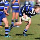 Kaikorai Under 12 Demons wing Rachael Pitts runs with the ball at the Taieri sevens tournament in...