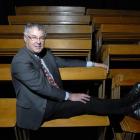 Kaikorai Valley College principal Philip Craigie sits among the 150 school hall pews which will...
