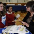 Kaikorai Valley College pupils Rebekah Sonntag (left) and Sophia Taing (both 14) receive...