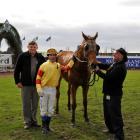 Kalgoorlie Bomber after his win at Riccarton on Saturday, with owner Colin Stevenson (left),...