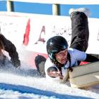 Karina Page, of Queenstown, shows how she hung on to win the women's section of the suitcase race...
